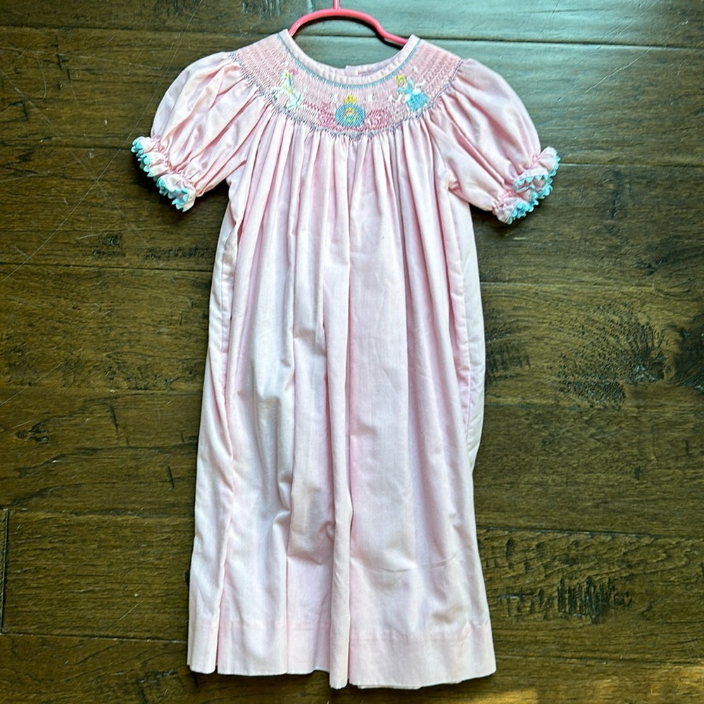 Pink gingham dress smocked with Cinderella, her chariot and a horse.  4T